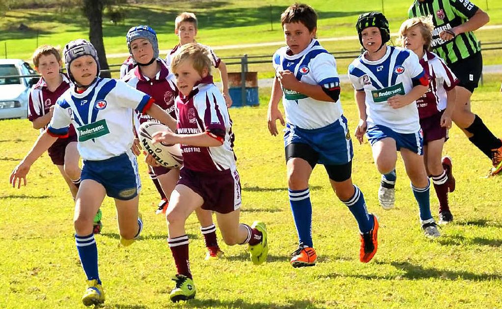 Suburbs U10 player Jaymen Murphy breaks through the Collegians defence. Suburbs U10 player Jaymen Murphy breaks through the Collegians defence.